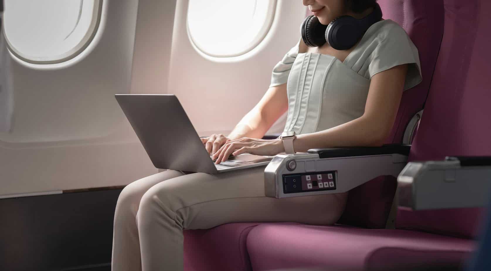 Woman Sits In The Airplane